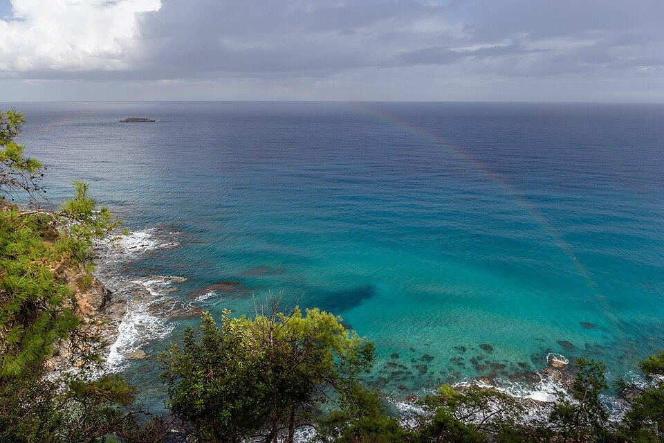 Rocky coast of Akamas Peninsula with a rainbow, Cyprus, Zypern